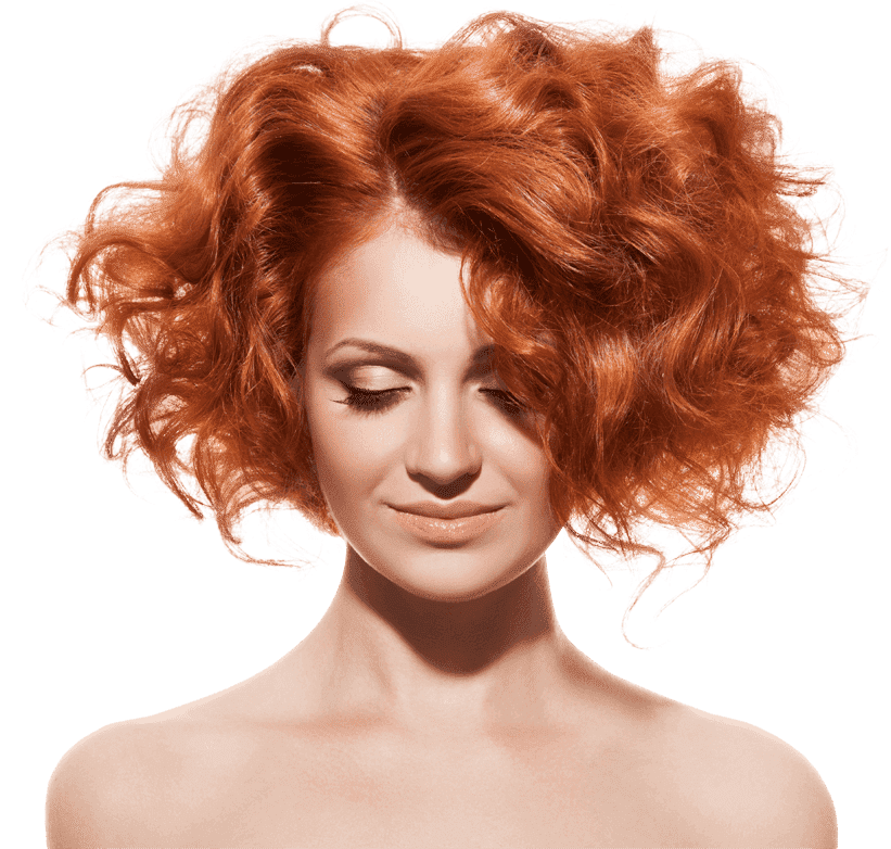A woman with vibrant red, curly hair styled voluminously, her eyes closed and a serene expression, isolated against a green background.