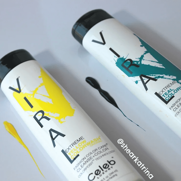 Two bottles of viral hair care shampoo and conditioner with splashes of yellow and blue paint next to them. the packaging has bold, colorful text against a white background.